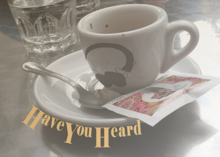 The show image of Have You Heard. It shows an espresso cup with a headphone design on it. Curved along the plate the cup rests on is the text, "Have You Heard".